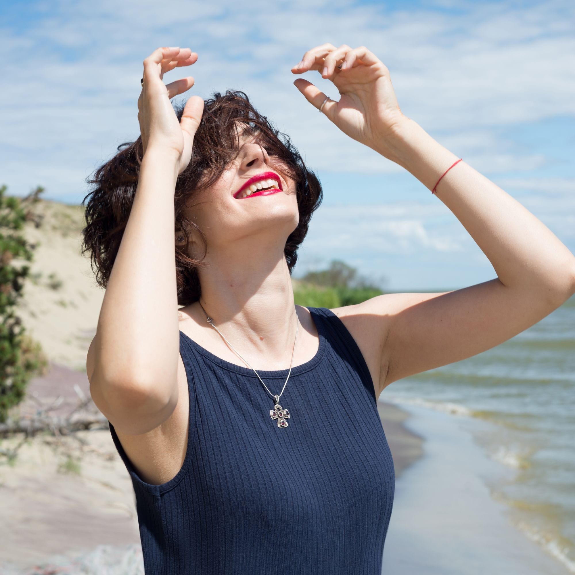 Woman Enjoying The Sun At The Beach